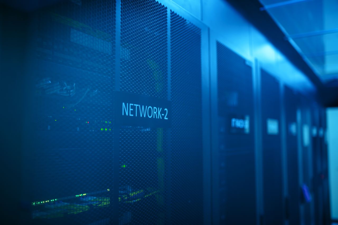 The Art of Drawing Readers In: Your attractive post title goes here A modern server room featuring network equipment with blue illumination. Ideal for technology themes.